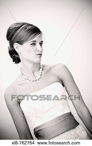 Picture - bride winking, puckering her lips. Fotosearch