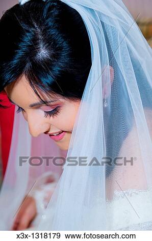 Stock Photo - Bride with a wedding veil. Fotosearch