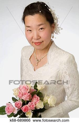 Bride with roses View Large Photo Image Stock Photograph - Bride with roses. Fotosearch