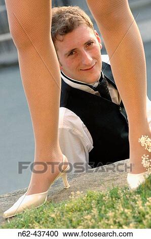 Bridegroom behind the legs of the bride. View Large Photo Image Stock Image - Bridegroom behind the legs of the bride.. Fotosearch