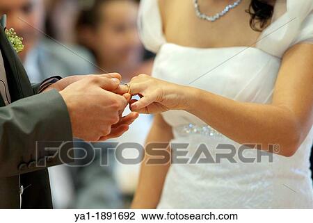 Bridegroom giving ring to bride during wedding ceremony, Firenze, Tuscany, Italy View Large Photo Image Stock Image - Bridegroom giving ring to bride during wedding ceremony, Firenze, Tuscany, Italy. Fotosearch