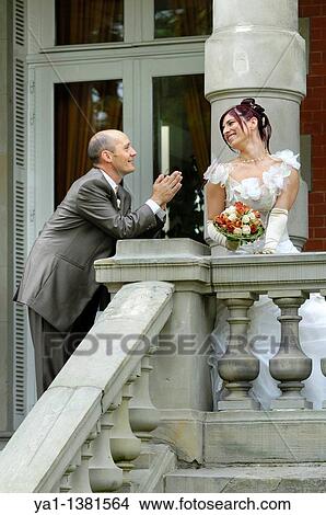 Picture - Bridegroom imploring his bride, France. Fotosearch