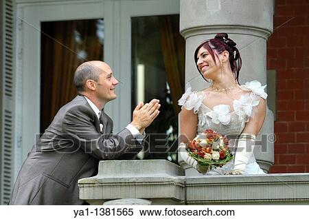 Bridegroom imploring his bride, France View Large Photo Image Stock Photography - Bridegroom imploring his bride, France. Fotosearch