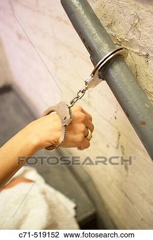 Bride's hand handcuffed to railing View Large Photo Image Stock Image - Bride's hand handcuffed to railing. Fotosearch