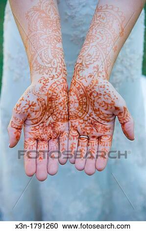 Brides hands covered in henna tattoo for Indian ceremony View Large Photo Image Stock Image - Brides hands covered in henna tattoo for Indian ceremony. Fotosearch