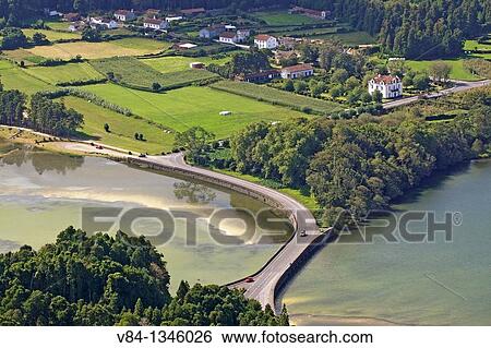 Bridge between Crater Lake Lagoa Verde and Lagoa Azul / Volcanic Crater Sete Cidades / Sao Miguel Island / Azores / Portugal View Large Photo Image Stock Photograph - Bridge between Crater Lake Lagoa Verde and Lagoa Azul / Volcanic Crater Sete Cidades / Sao Miguel Island / Azores / Portugal. Fotosearch