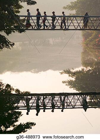 Bridge over a still lake in central Dhaka, Bangladesh View Large Photo Image Stock Image - Bridge over a still lake in central Dhaka, Bangladesh. Fotosearch