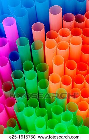 Stock Photo - Brightly colored plastic tubes close up to form an abstract composition. Fotosearch