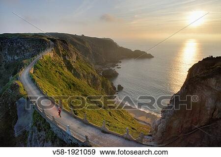 British Crown dependency, Isle of Sark, La Coupee at sunset View Large Photo Image Stock Photo - British Crown dependency, Isle of Sark, La Coupee at sunset. Fotosearch