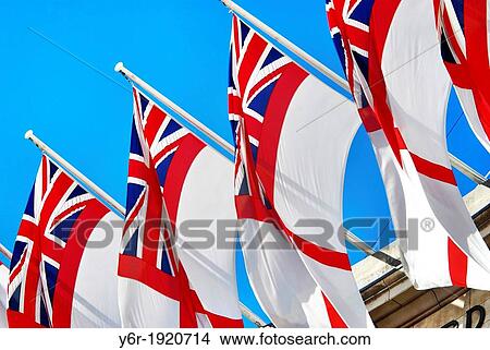 British Royal Navy flags hanging from Admiralty Arch in central London, on the edge of Trafalgar Square, on a sunny Summer day in England View Large Photo Image Picture - British Royal Navy flags hanging from Admiralty Arch in central London, on the edge of Trafalgar Square, on a sunny Summer day in England. Fotosearch
