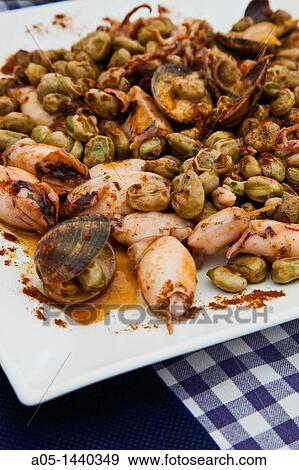Stock Photo - Broad beans with squids, Tossa de Mar, La Selva, Costa Brava, Girona province, Catalonia, Spain.. Fotosearch