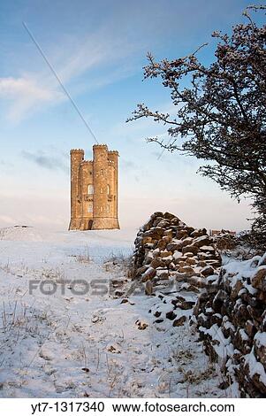 Broadway tower in winter snow in the Cotswolds, Gloucestershire UK View Large Photo Image Stock Image - Broadway tower in winter snow in the Cotswolds, Gloucestershire UK. Fotosearch