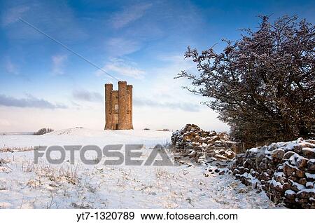 Stock Photo - Broadway tower in winter snow in the Cotswolds, Gloucestershire UK. Fotosearch
