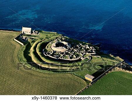 Stock Photo - Broch of Gurness Iron Age village Central tower radial adjoining houses and wall Eynhallow Sound, Mainland, Orkney, Scotland. Fotosearch