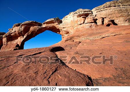 Broken Arch Water and ice, extreme temperatures, and underground salt movement are responsible for the scultured rock scenery of Arches National Park View Large Photo Image Stock Photo - Broken Arch Water and ice, extreme temperatures, and underground salt movement are responsible for the scultured rock scenery of Arches National Park. Fotosearch
