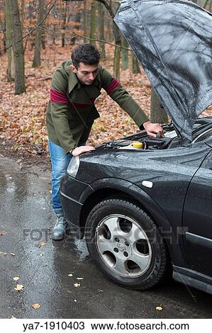 Stock Image - Broken down car. Fotosearch