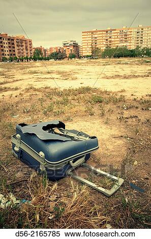 Stock Photography - broken suitcase on the floor, Valencia, Spain.. Fotosearch