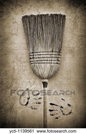 Stock Image - Broom against the wall. Fotosearch