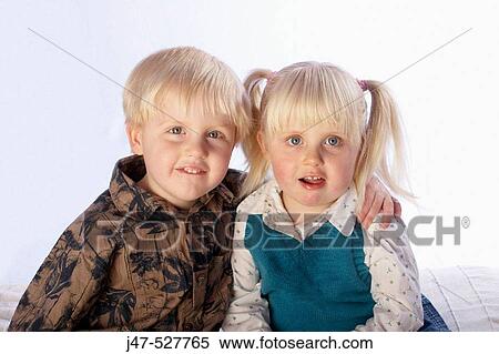 brother and sister, 3 and 4, sitting together, smiling into camera View Large Photo Image Stock Photography - brother and sister, 3 and 4, sitting together, smiling into camera. Fotosearch