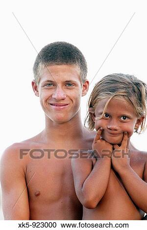 Brother and sister on the beach View Large Photo Image Stock Image - Brother and sister on the beach. Fotosearch
