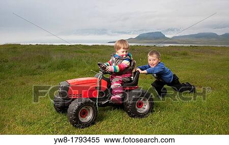 Brother and Sister playing on the farm, Eskifjordur, Iceland View Large Photo Image Stock Photography - Brother and Sister playing on the farm, Eskifjordur, Iceland. Fotosearch