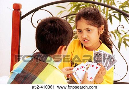 Brother sister playing cards. View Large Photo Image Stock Image - Brother sister playing cards.. Fotosearch