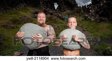 Brothers carrying heavy stones, Iceland. View Large Photo Image Picture - Brothers carrying heavy stones, Iceland.. Fotosearch