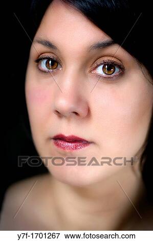 Brown eyed woman View Large Photo Image Stock Photo - Brown eyed woman. Fotosearch