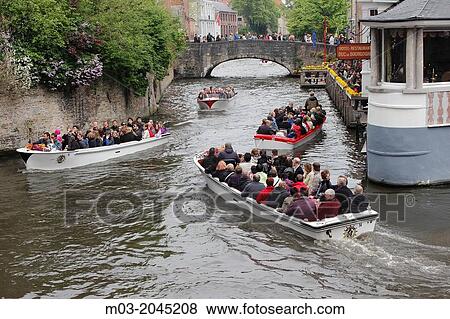 Bruges Belgium Flanders Europe Brugge Belgian tourist boats on canal. View Large Photo Image Stock Photo - Bruges Belgium Flanders Europe Brugge Belgian tourist boats on canal.. Fotosearch