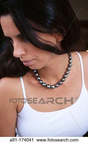 Brune woman with black Tahitian pearls necklace View Large Photo Image Stock Image - Brune woman with black Tahitian pearls necklace. Fotosearch