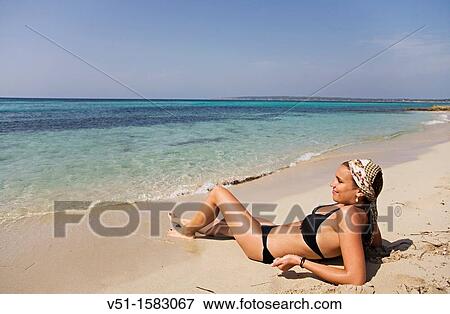 Brunette beautiful woman at the beach in Formentera View Large Photo Image Stock Photo - Brunette beautiful woman at the beach in Formentera. Fotosearch