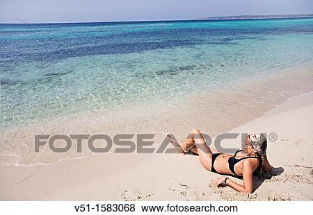 Brunette beautiful woman at the beach in Formentera View Large Photo Image Stock Photo - Brunette beautiful woman at the beach in Formentera. Fotosearch