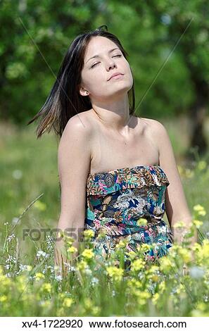 Brunette breathing fresh air in the ruralscape View Large Photo Image Stock Image - Brunette breathing fresh air in the ruralscape. Fotosearch