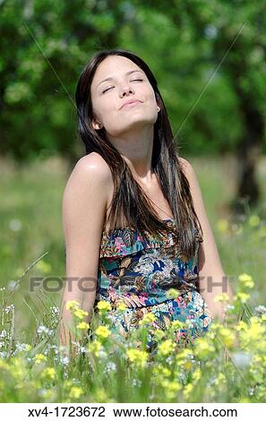 Brunette breathing fresh air in the ruralscape View Large Photo Image Stock Image - Brunette breathing fresh air in the ruralscape. Fotosearch