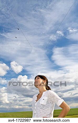 Brunette breathing fresh air in the ruralscape View Large Photo Image Stock Photo - Brunette breathing fresh air in the ruralscape. Fotosearch