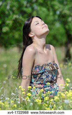 Brunette breathing fresh air in the ruralscape View Large Photo Image Stock Photo - Brunette breathing fresh air in the ruralscape. Fotosearch