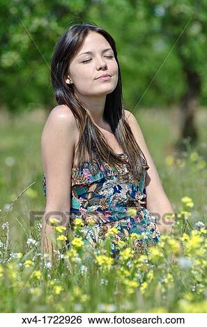 Brunette breathing fresh air in the ruralscape View Large Photo Image Stock Photograph - Brunette breathing fresh air in the ruralscape. Fotosearch