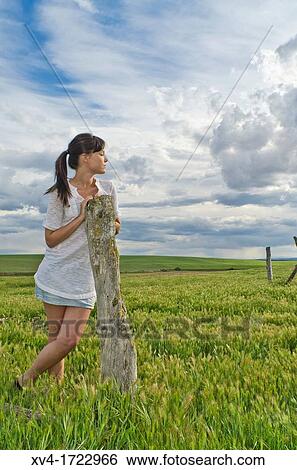Brunette breathing fresh air in the ruralscape View Large Photo Image Stock Photograph - Brunette breathing fresh air in the ruralscape. Fotosearch