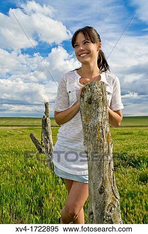 Brunette breathing fresh air in the ruralscape View Large Photo Image Stock Photography - Brunette breathing fresh air in the ruralscape. Fotosearch