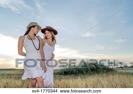 Brunette couple dancing and walk in the countryside View Large Photo Image Picture - Brunette couple dancing and walk in the countryside. Fotosearch
