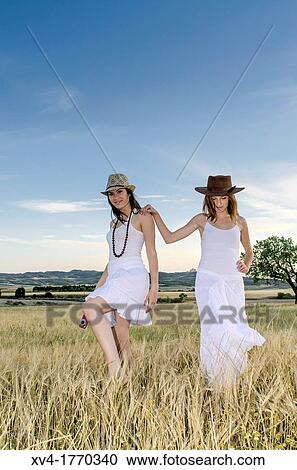 Brunette couple dancing and walk in the countryside View Large Photo Image Stock Image - Brunette couple dancing and walk in the countryside. Fotosearch