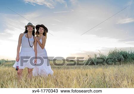Brunette couple dancing and walk in the countryside View Large Photo Image Stock Image - Brunette couple dancing and walk in the countryside. Fotosearch