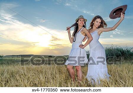 Brunette couple dancing and walk in the countryside View Large Photo Image Stock Image - Brunette couple dancing and walk in the countryside. Fotosearch