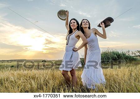 Brunette couple dancing and walk in the countryside View Large Photo Image Stock Image - Brunette couple dancing and walk in the countryside. Fotosearch
