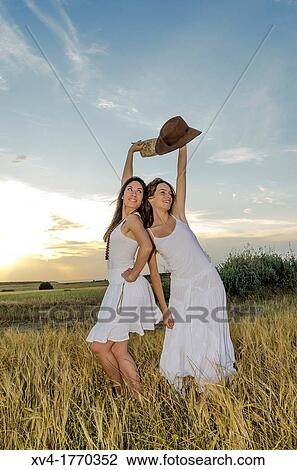 Brunette couple dancing and walk in the countryside View Large Photo Image Stock Image - Brunette couple dancing and walk in the countryside. Fotosearch