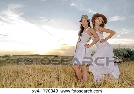 Brunette couple dancing and walk in the countryside View Large Photo Image Stock Photo - Brunette couple dancing and walk in the countryside. Fotosearch