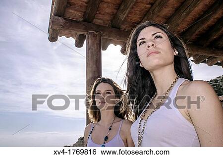 Brunette couple relaxing and enjoy in the countryside View Large Photo Image Stock Photograph - Brunette couple relaxing and enjoy in the countryside. Fotosearch