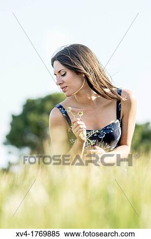 Brunette enjoy in the countryside View Large Photo Image Stock Photography - Brunette enjoy in the countryside. Fotosearch