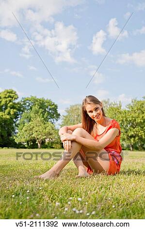 Brunette pretty woman in park smiling at camera View Large Photo Image Stock Image - Brunette pretty woman in park smiling at camera. Fotosearch