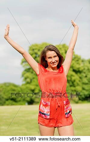 Brunette pretty woman in park smiling at camera View Large Photo Image Stock Photo - Brunette pretty woman in park smiling at camera. Fotosearch